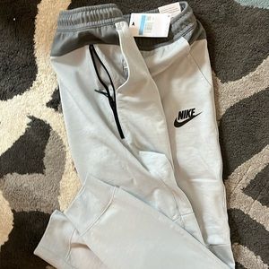 New!! NIKE Men’s Medium Joggers; slim fit taper Leg regular length.